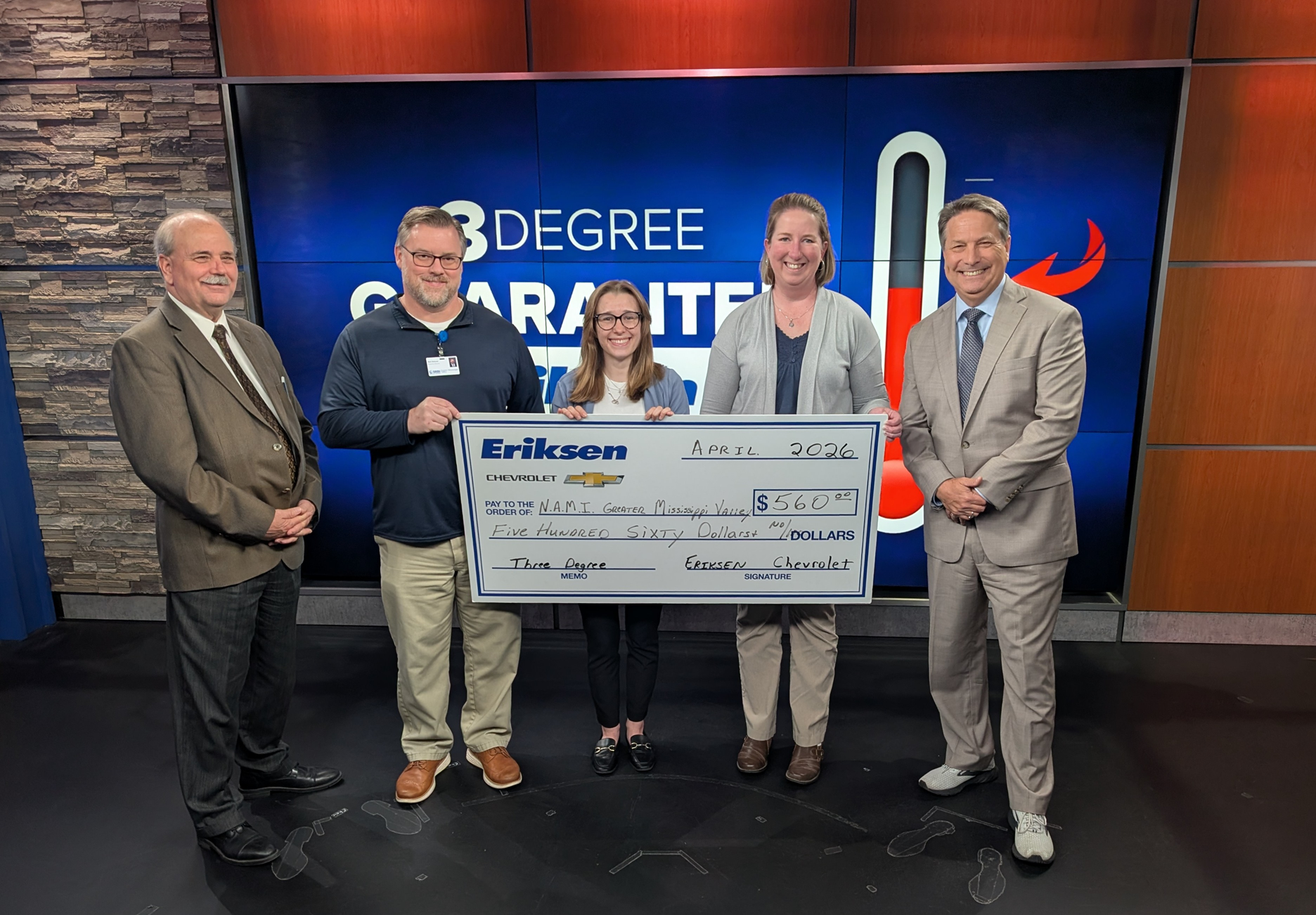 Pictured from left are Tom; Mark Mathews, Emma Nelson and Brooke Hendrickx, of NAMI Greater Mississippi Valley; and James Zahara